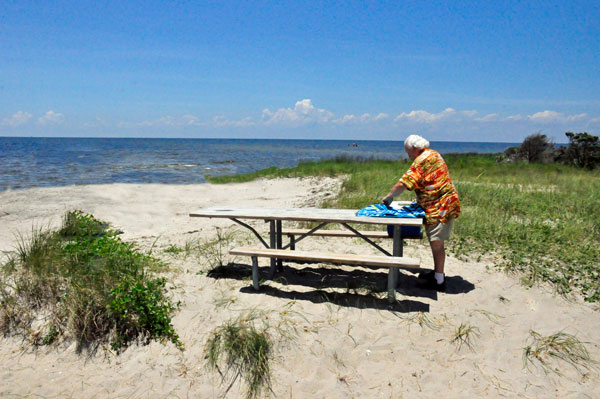 Lee Duquette setting up lunch on the beach